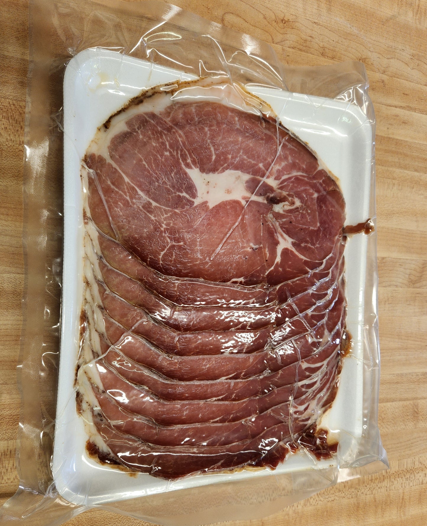 M215 Meacham Country Ham Custom Cooked and sliced in 2# package. SLICED